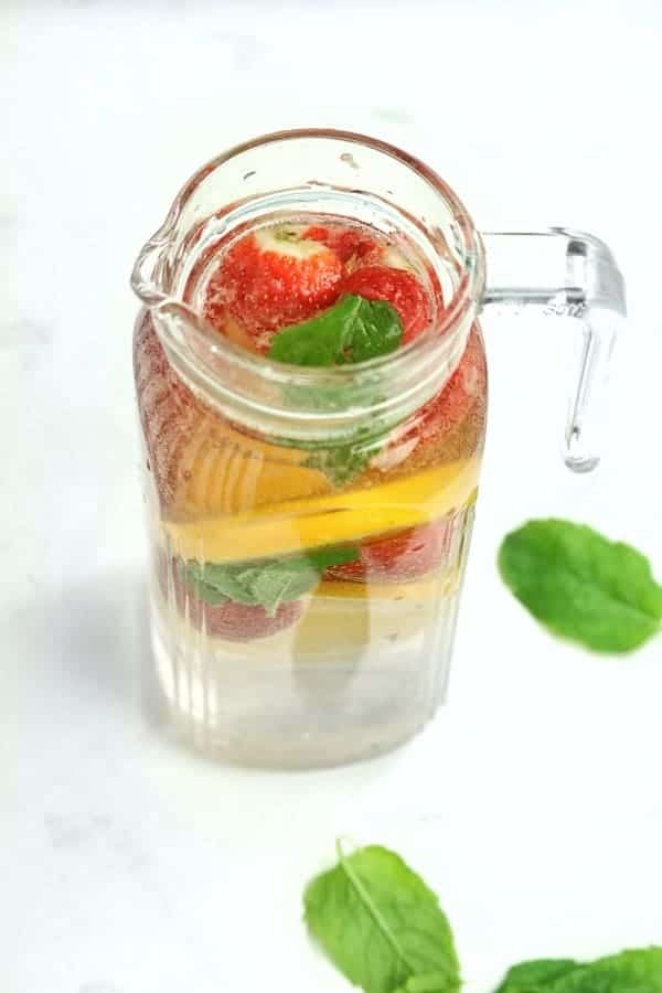 Fruit infused water in a pitcher.
