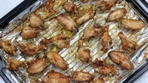 baked chicken wings on an oven tray.