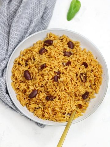 Rice and beans served in a light blue plate.