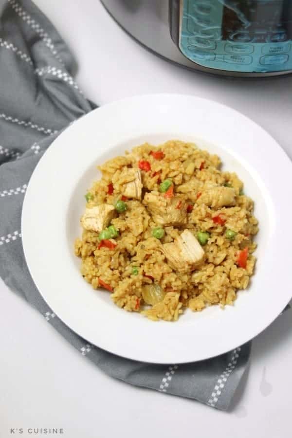 chicken paella served in white plate.